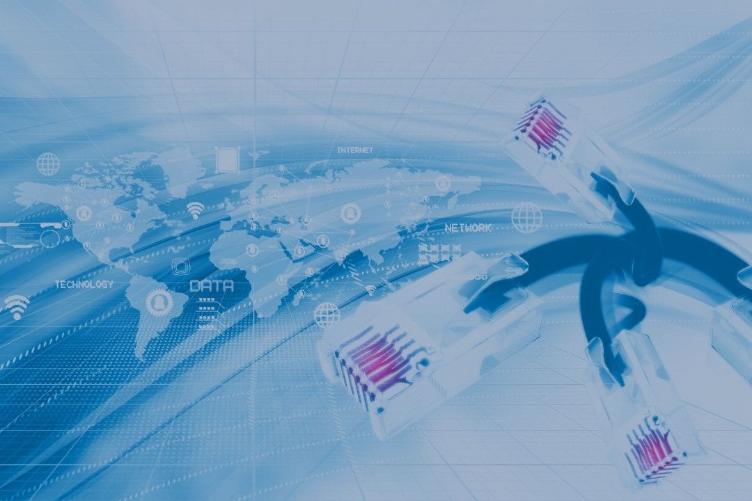 Network cables with a map of the world behind it