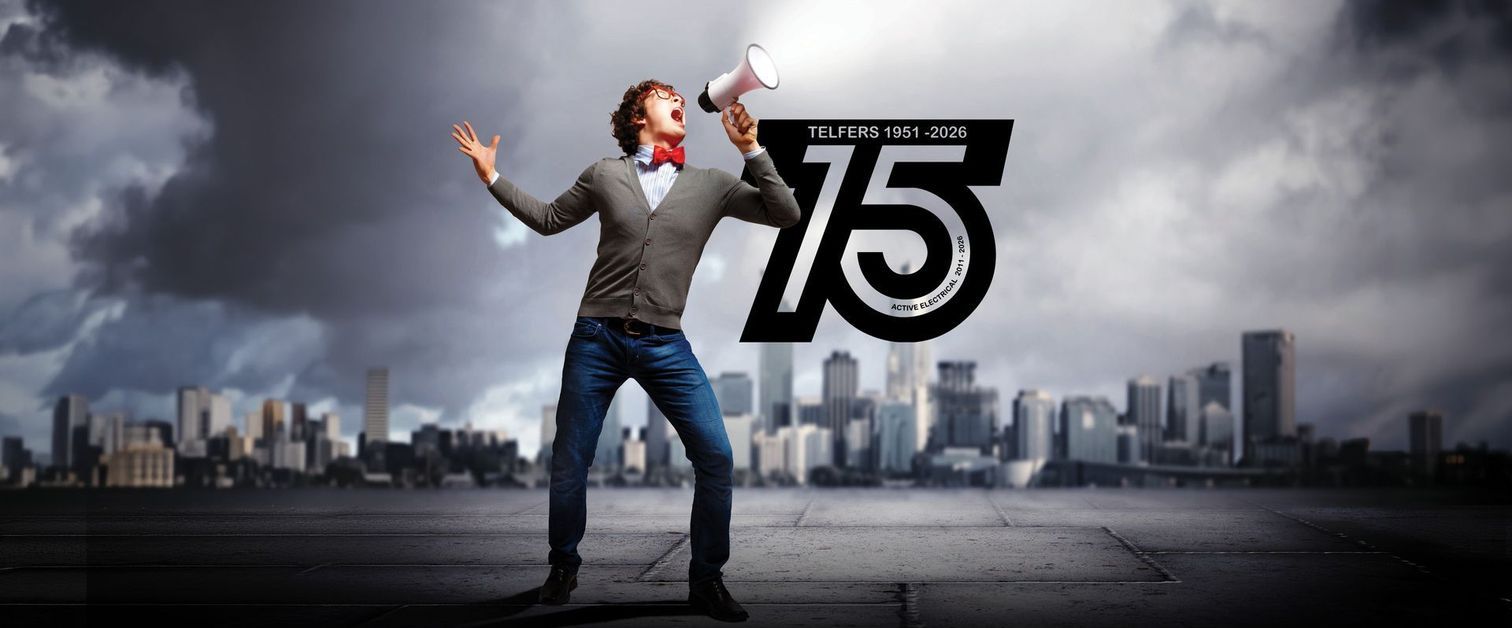 Man shouting into a megaphone next to the Telfers 75 years logo