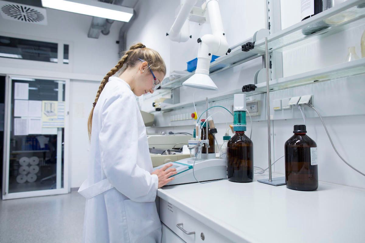 doctor looking at tests in room with wall plugs