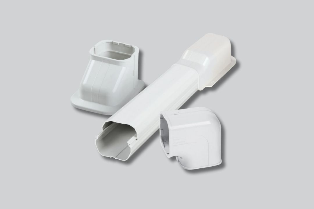 White airconditioning components on a grey backgroud