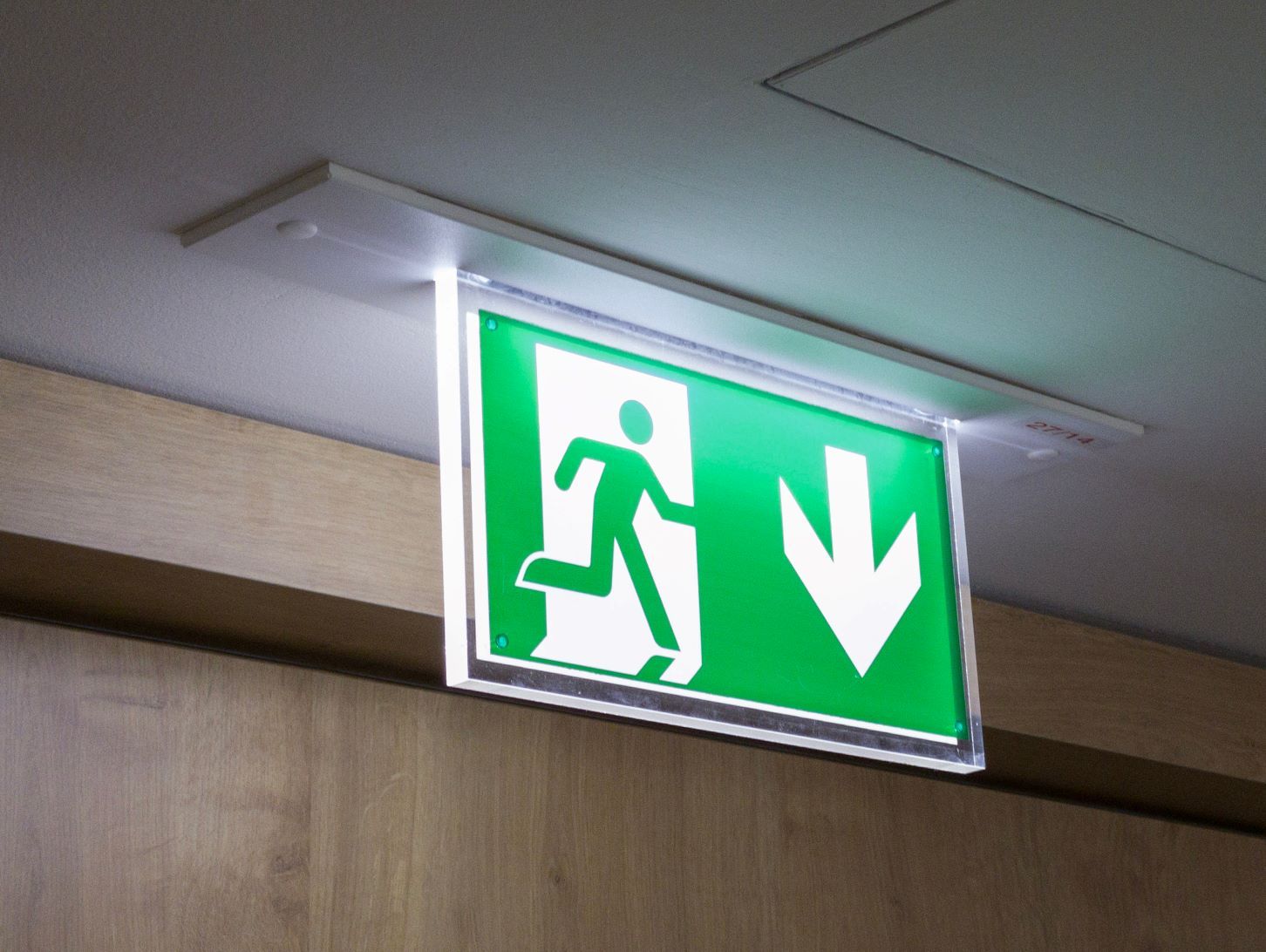 Green emergency exit with running man