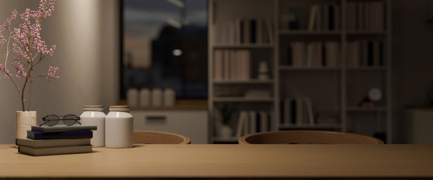 Wood dining table with copy space over blurred living room in the background